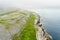 Spectacular misty aerial landscape in the Burren region of County Clare, Ireland. Exposed karst limestone bedrock at the Burren