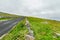 Spectacular misty landscape in the Burren region of County Clare, Ireland. Exposed karst limestone bedrock at the Burren National