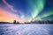 spectacular multicolored aurora display across a snowy landscape