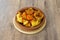 Spectacular portion of patatas bravas a la madrileÃ±a in a clay pot