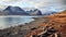 Spectacular Rocky Coastline With Mountain Backdrop In Silver And Amber