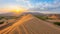 Spectacular sahara desert panorama at sunset with golden sand dunes captivating landscape banner