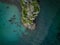 Spectacular scene featuring an array of vibrant-hued rocks, surrounded by tranquil turquoise waters.