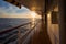 Spectacular sunrise over sea horizon seen from the upper deck of a cruise ship