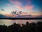 Spectacular sunset above Mississippi river near Natchez with clouds and reflections in water