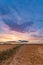 Spectacular sunset over stubble field