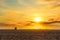 Spectacular Sunset at Venice Beach: Towering Sun and Delighted Beachgoers