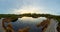 Spectacular sunset view of a lake surrounded by wetlands.