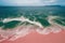 Spectacular top view from drone photo of beautiful pink beach.