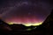 Spectacular view as aurora lights up the sky of Queenstown, New Zealand