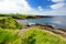 Spectacular view of Mullaghmore Head with huge waves rolling ashore. Picturesque scenery with magnificent Classiebawn Castle. Wild