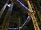 A spectacular view of people walking walking high in the tree tops at the capilano suspension bridge christmas light display