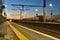 Spectacular view of railway station and colorful sky at Blackrock in the evening, Dublin, Ireland. Lights of the coming train