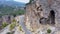 Spectacular view of steep rocky cliff above mountain road.