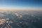 Spectacular view of a sunset above the clouds from airplane wind