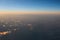 Spectacular view of a sunset above the clouds from airplane wind