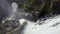 Spectacular view of a waterfall from above, discharged from a swamp by thawing. Atazar, Madrid