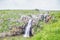 Spectacular water flow over the basalt canyon rocks and Iris Waterfall in the Golan heights