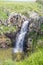 Spectacular water flow over the basalt canyon rocks and Iris Waterfall in the Golan heights