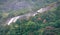 Spectacular waterfall among tropical mountain forests