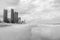 Spectacular wide panorama of the Gold Coast skyline and Surfers Paradise beach on a cloudy day.