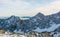 Spectacular winter mountain panorama with peaks covered with early snow.