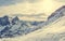 Spectacular winter mountain panorama with peaks covered with early snow.