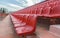 Spectator bleachers on an open soccer field. Stadium for summer football matches. Outdoor stadium