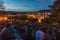 Spectators waiting for fireworks festival show at Observatory Park hill over Geneva city at dusk during beautiful summer evening,