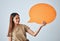 Speech bubble, smile and portrait of woman in studio isolated on a white background. Social media, poster and happy girl