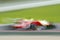 Speed-blurred racing vehicle