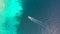 Speed Boat floats on the beautiful sea turquoise water. Aerial view of boat rushes across the blue sea.
