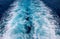 Speed boat trail on sea water photo. White foam on blue water. Ocean transportation. Tropical island hopping concept