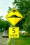 A Speed Bump sign with a speed recommendation sign