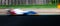 Speed concept blurred motion racing car asphalt track side view