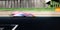 Speed concept blurred motion racing car asphalt track side view