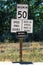 A Speed Fines Double Begins sign along a highway