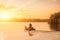 Speed fishing boat in the river with sunset.