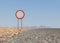 Speed limit sign at a desert road