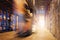 Speed Motion Blur of Forklift Driver Working at The Warehouse.