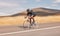 Speed, nature and road, man on bicycle for workout, exercise and scenic mountain path. Health, wellness and cyclist on