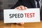 Speed test, message on white card and hold by