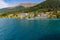 Speedboat and Hillside houses in Queenstown Otago New Zealand rising from the shore of Lake Wakatipu