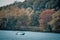 Speedboat in lake Ontario in autumn. Colourful vivid trees. Canada Usa