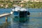 Speedboat with moored buoys tied up to a wooden pier