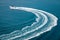 Speedboat runs fast in the open sea and leaves the engine`s wake in the water