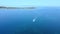 Speedboat sails on exotic sea. Travel and adventure concept. Aerial view