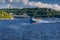 Speedboat sails on the river against the beautiful sky