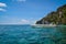 A speedboat in sea in front of Island