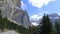 Speeding car on a winding road in the Dolomites